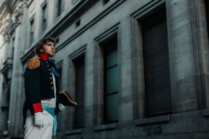 Man dressed in historical military uniform in Buenos Aires urban setting.